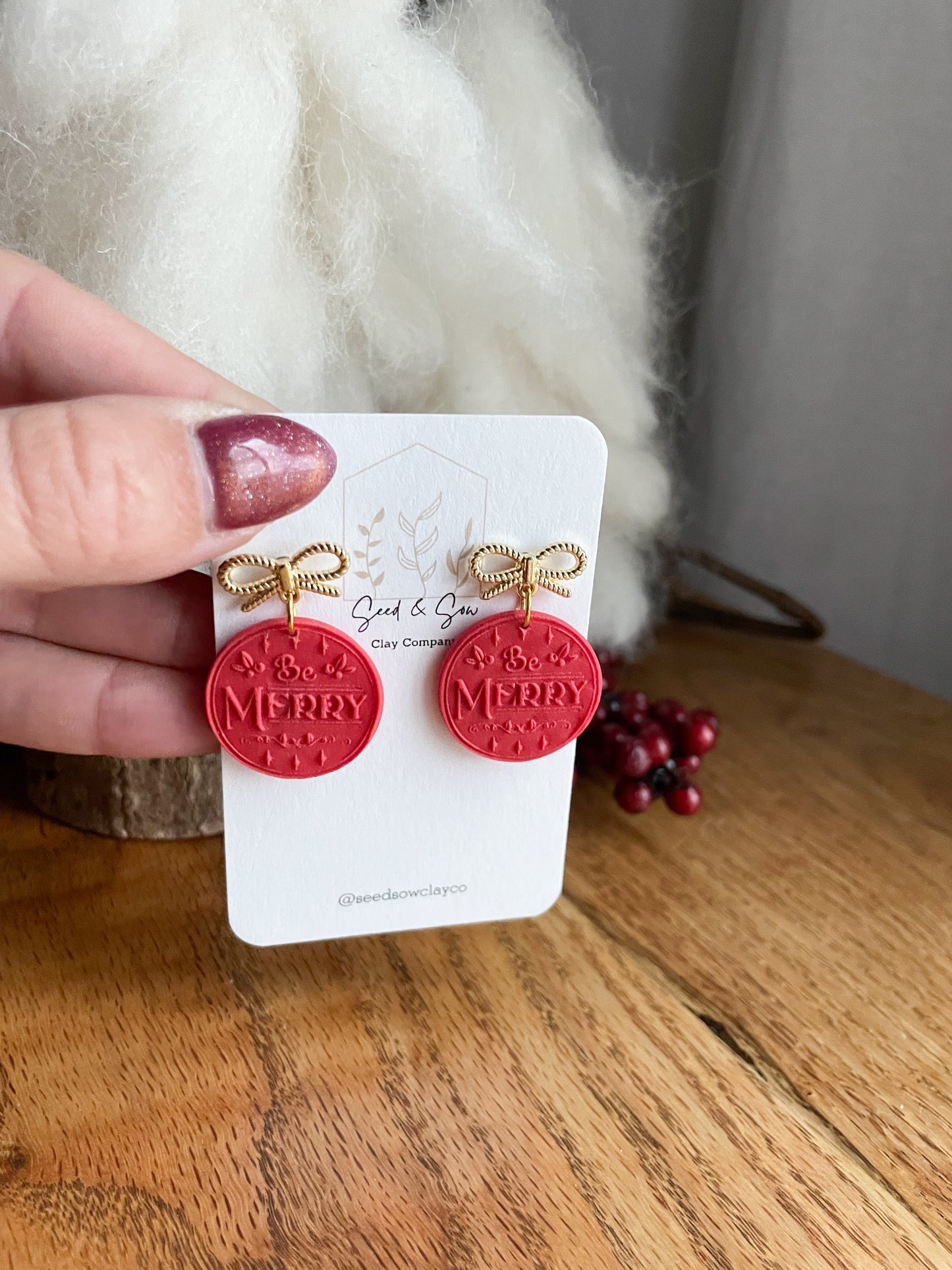 Bright Red "Be Merry" on Gold Bow