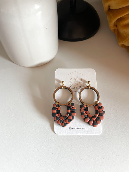 Black and Orange Checker Dangle on Wood